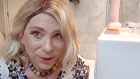 Blonde amateur milf fucks a dildo in her anal hole