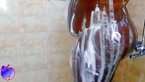 Ebony woman shows off her body in shower and blowjob