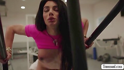 Brunette girl is getting her legs railed in the gym